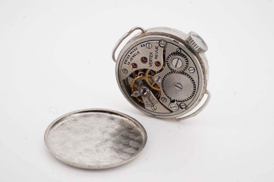 A lady's mid 20th century white metal and diamond set Vertex manual wind wrist watch, with dot and Arabic numerals, case diameter 21mm, no strap.